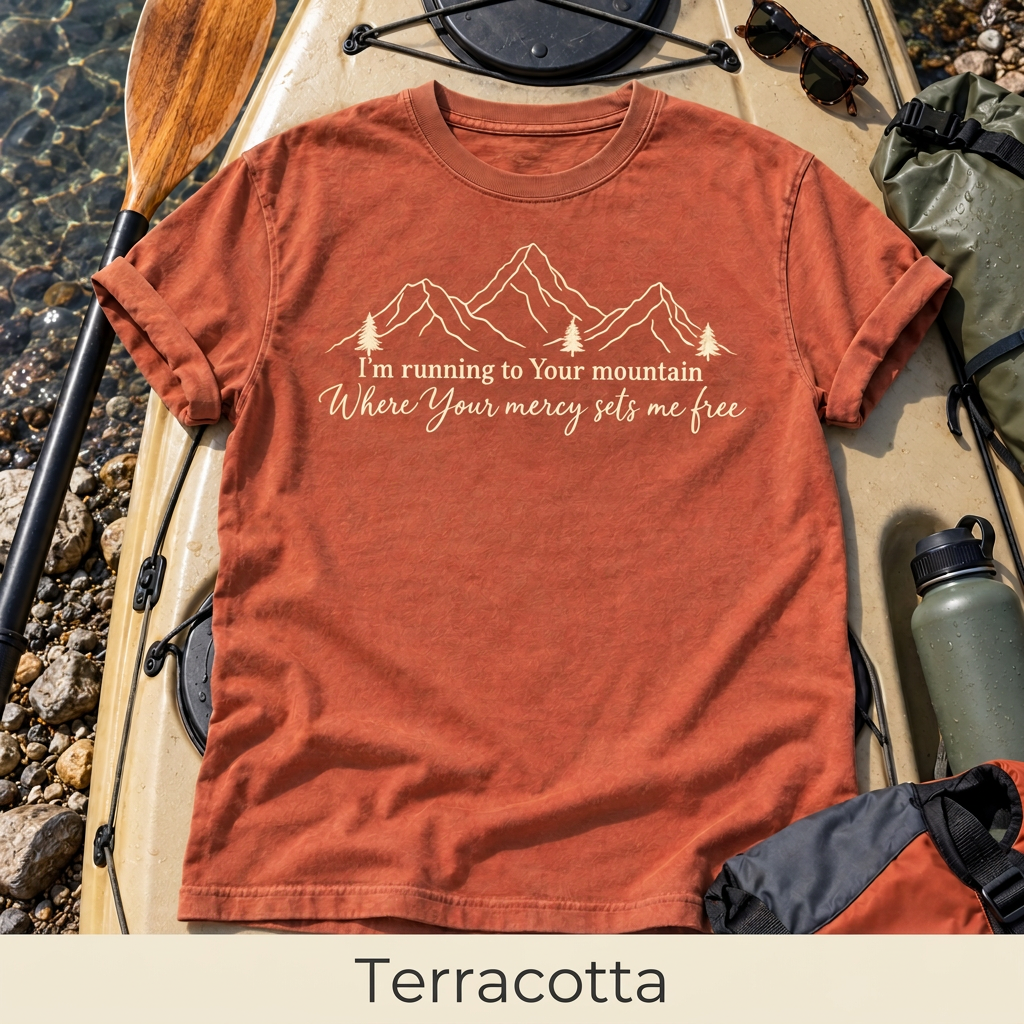 Mercy Sets Me Free T-shirt in Terracotta, with the color name labeled beneath the mockup